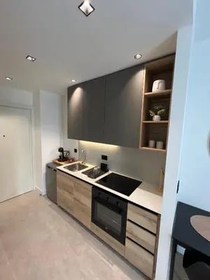 a kitchen with a sink and a stove at BW Simfonia Apartman 407-whit free garage parking in Belgrade
