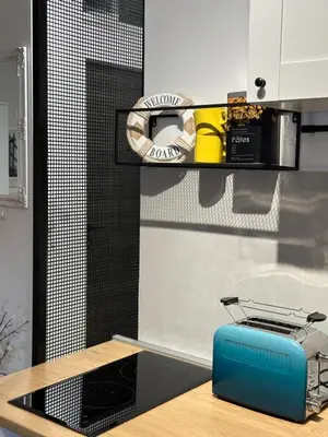 a kitchen with a blue toaster on a counter at Sleep&Fly 1 Belgrade in Belgrade