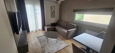 a small living room with a couch and a table at Todd in Belgrade