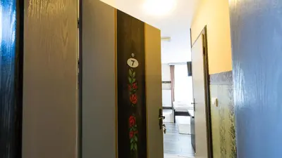 a room with a door with a clock on it at Imanje Borkonjić in Ruma
