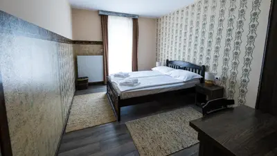 a bedroom with a bed and a window at Imanje Borkonjić in Ruma