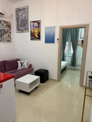 a living room with a couch and a table at Apartment Republic Square in Belgrade