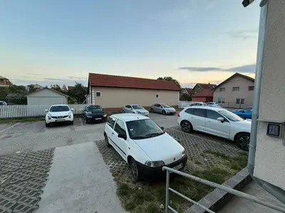 a group of cars parked in a parking lot at Element Apartman Obrenovac, Privatni Parking in Obrenovac