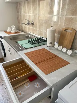 a kitchen with a sink and a counter top at Apartmani Kersbaum in Belgrade