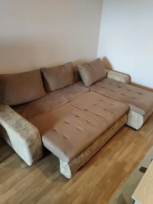 a brown couch sitting in a living room at Stan na dan MARA in Mladenovac