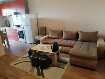 a living room with a couch and a table at Stan na dan MARA in Mladenovac