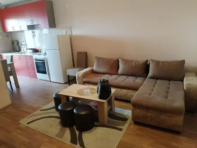 a living room with a couch and a table at Stan na dan MARA in Mladenovac