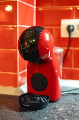 a red blender sitting on top of a counter at Cozy Heaven in Belgrade