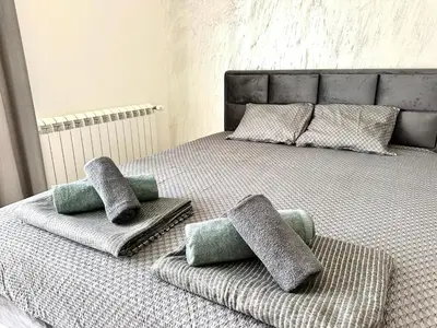 two pillows on top of a bed in a bedroom at River Sight Studio - BW SIMPHONY in Belgrade