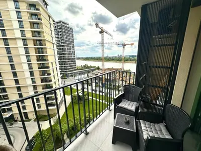 a balcony with chairs and a view of a building at River Sight Studio - BW SIMPHONY in Belgrade