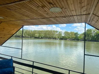 a view of a river from the bow of a boat at SplavTisa-Titel in Titel