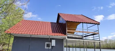 a building with a red roof on top of it at SplavTisa-Titel in Titel