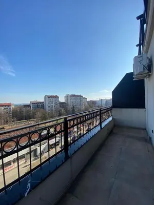a balcony with a view of a train track at ast13r 12451f in Belgrade