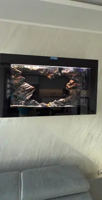 a fireplace in a living room with a fire in it at Taurunum lux Apartment 30 in Belgrade
