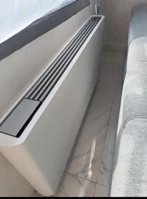 a white bath tub sitting next to two beds at Taurunum lux Apartment 30 in Belgrade