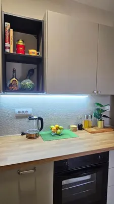 a kitchen counter with a plate of fruit on it at Magnolija stan na dan in Belgrade
