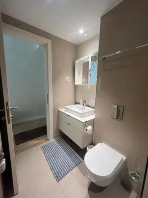 a bathroom with a toilet and a sink at Belgrade Waterfront Cozy Studio in Belgrade