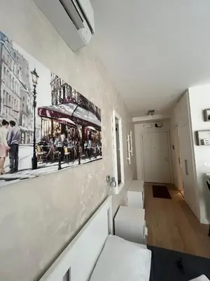 a room with a picture of a carousel on the wall at Belgrade Waterfront Cozy Studio in Belgrade