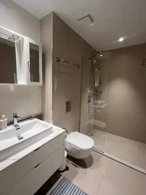 a bathroom with a sink and a toilet and a shower at Belgrade Waterfront Cozy Studio in Belgrade