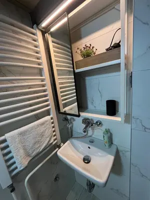 a bathroom with a sink and a mirror at Studio MB in Belgrade