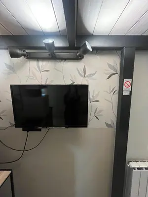 a flat screen tv hanging on a wall at Studio MB in Belgrade