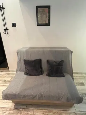 a bed with two pillows on it in a room at Studio MB in Belgrade