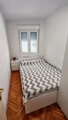 a bed in a room with a window at Brod Trgovacka in Žarkovo