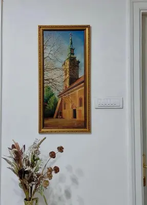 a picture of a church on a wall at Apartment Ksenija in Belgrade