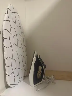 a white and black appliance sitting on a counter at Silent hill apartment in Belgrade