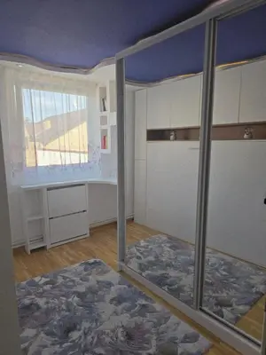 an empty room with a bed and a window at Sun lux in Belgrade