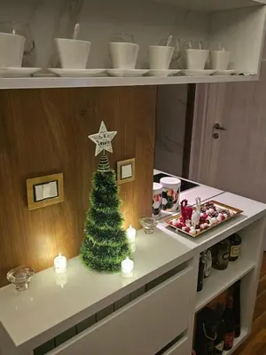 a christmas tree on a counter with a christmas ornament at Sun lux in Belgrade