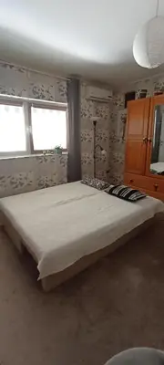 a bedroom with a large bed in a room at Kucica Slobodica in Bukorovac
