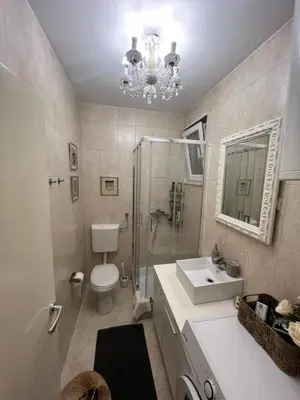 a bathroom with a toilet and a sink and a shower at Joker 5 in Belgrade