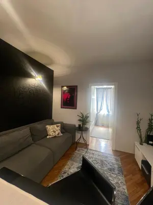 a living room with a couch and a window at Joker 5 in Belgrade