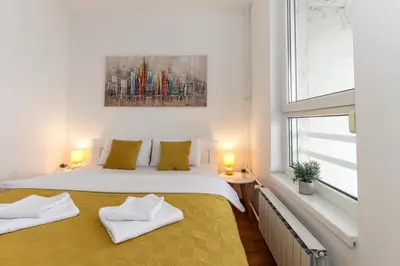a bedroom with a large bed with two pillows at Lavina 2 apartman u Belvilu, Novi Beograd, parking 5eur-dan in Novi Beograd