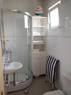 a bathroom with a shower and a sink at Apartment Bella Vista in Belgrade