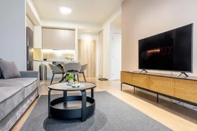 a living room with a large flat screen tv at BW Lux apartments Beograd na vodi in Belgrade