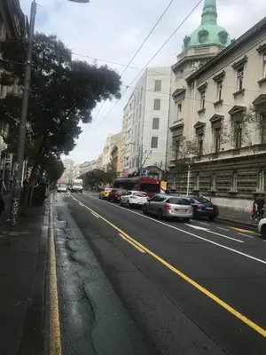 a city street with cars parked on the side of the road at Apartment Lilly in Belgrade
