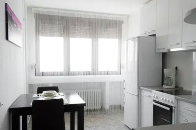 a kitchen with a table and a window in it at Apartment Lilly in Belgrade