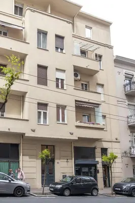 a building with cars parked in front of it at Maison Royale Premium Apartment in Belgrade