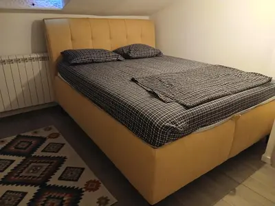 a bed with two pillows on it in a room at Kalemegdan in Belgrade