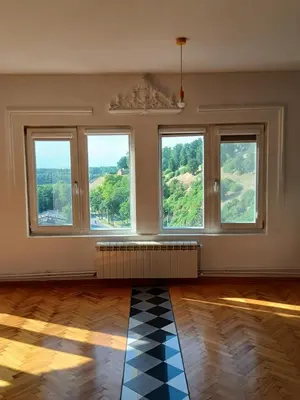 an empty room with windows and a checkered floor at Kalemegdan in Belgrade