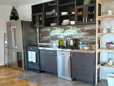 a kitchen with a stainless steel refrigerator and cabinets at Kalemegdan in Belgrade