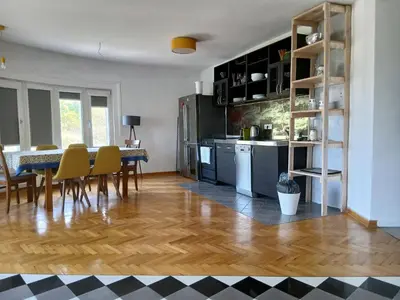 a kitchen and dining room with a table and chairs at Kalemegdan in Belgrade