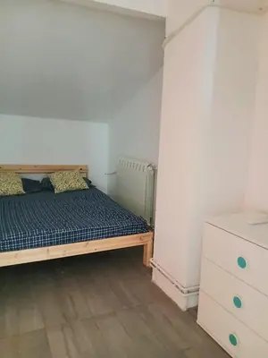 a bedroom with a bed and a dresser at Kalemegdan in Belgrade