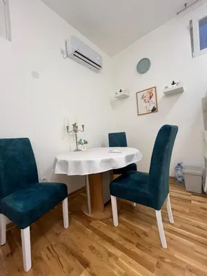 a dining room with a table and two chairs at Forests nest in Belgrade