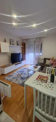 a living room with a couch and a table at Miletić Lux in Zemun