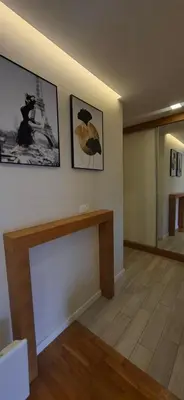 a living room with two pictures on the wall at Miletić Lux in Zemun