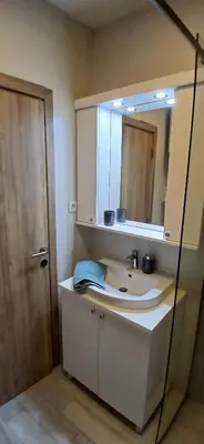 a bathroom with a sink and a mirror at Miletić Lux in Zemun