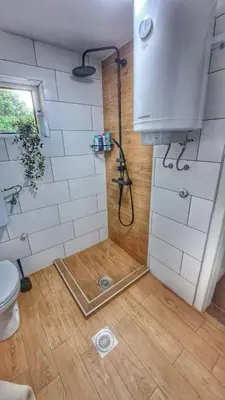 a shower in a bathroom with a toilet at Kucica na Dunavu in Kovin